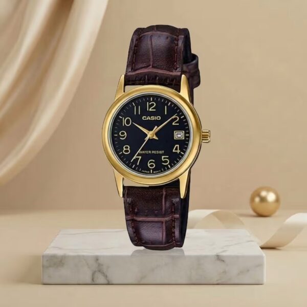 Casio ladies black dial watch with gold-tone case, brown leather strap and date display