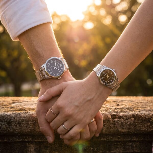 Couple holding hand wearing affordable couple watch set. Male wearing MTP V001D 1B watch and female wearing LTP V001D 1B watch.