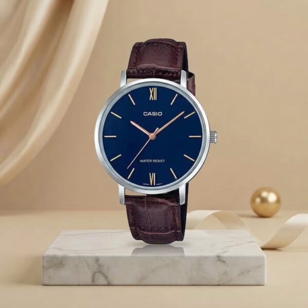 Casio ladies blue dial watch with silver-tone case, rose-gold markers and brown leather strap