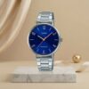 Casio ladies blue dial watch with silver stainless-steel bracelet and rose-gold hands and hour markers