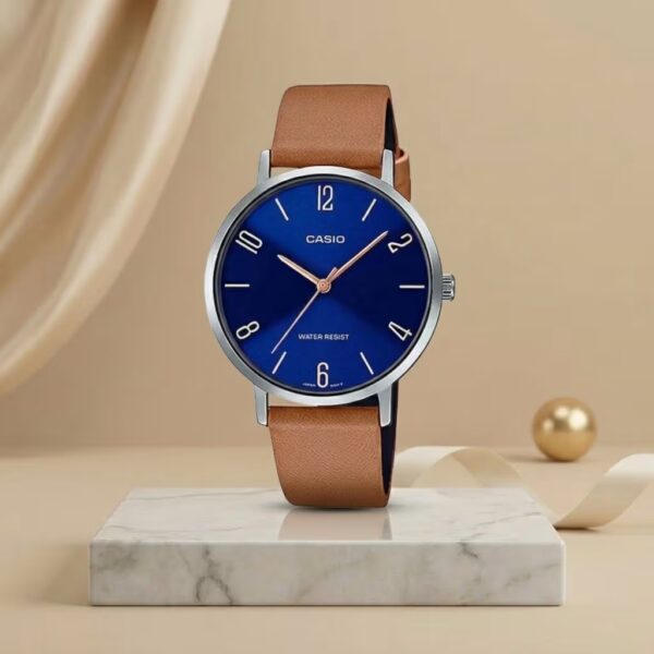 Casio ladies blue dial watch with silver-tone case, tan leather strap and rose-gold hands