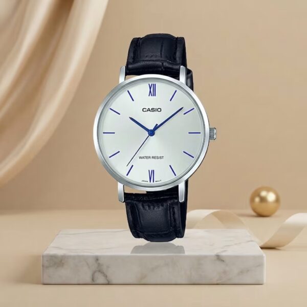 Casio ladies white dial watch with blue hands and hour markers, silver-tone case and black leather strap