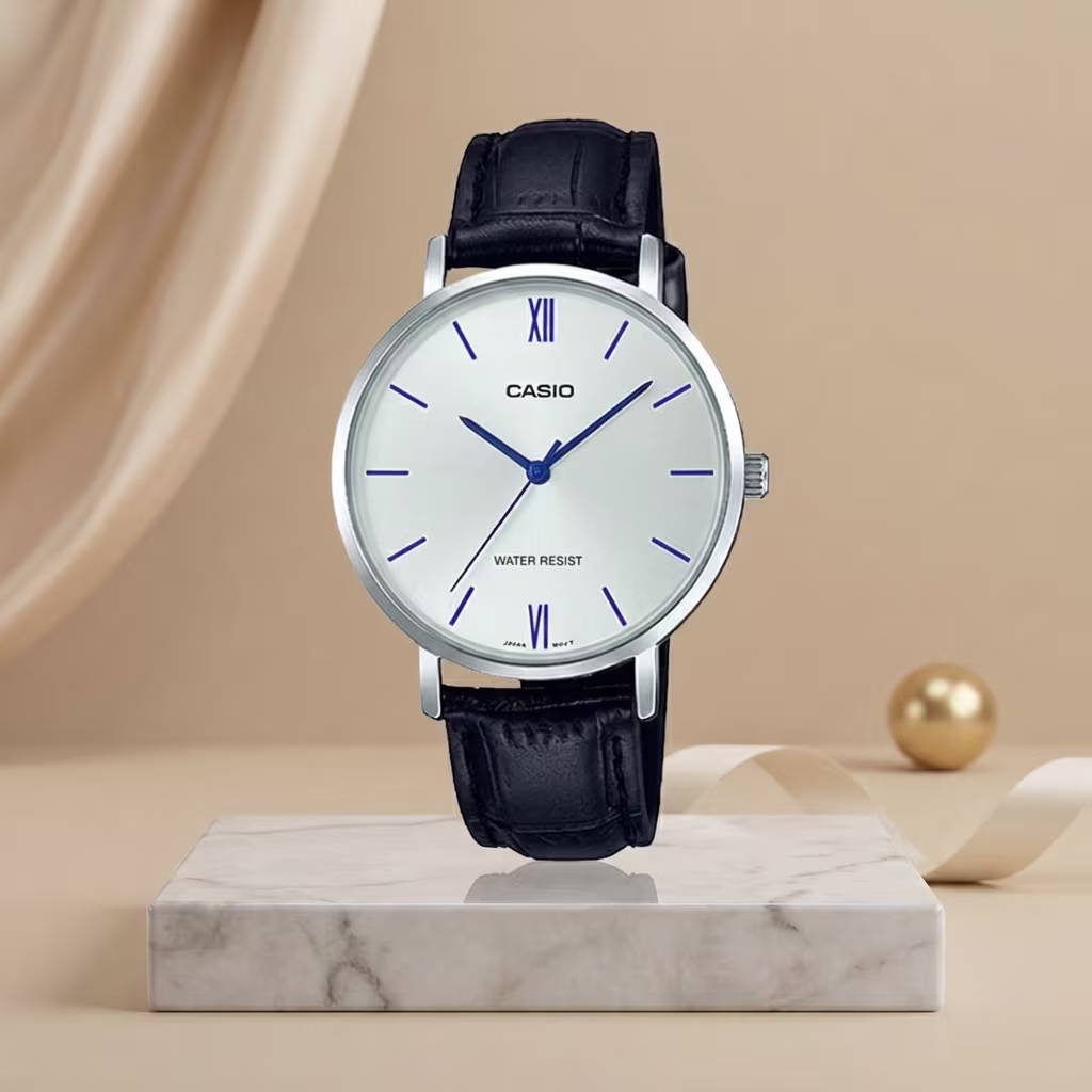 Casio ladies white dial watch with blue hands and hour markers, silver-tone case and black leather strap