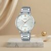 Casio ladies white dial watch with silver stainless-steel bracelet and rose-gold hands and hour markers