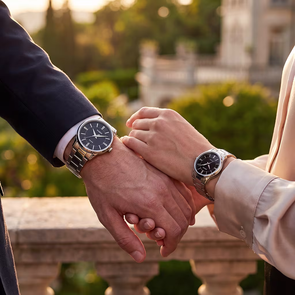 Couple holding Casio gift watches. Male wearing MTP 1303D 1AV and female wearing LTP 1303D 1AV
