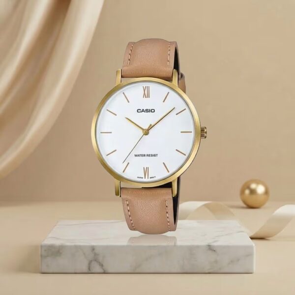 Casio ladies white dial watch with gold-tone case, beige leather strap and minimalist analog design
