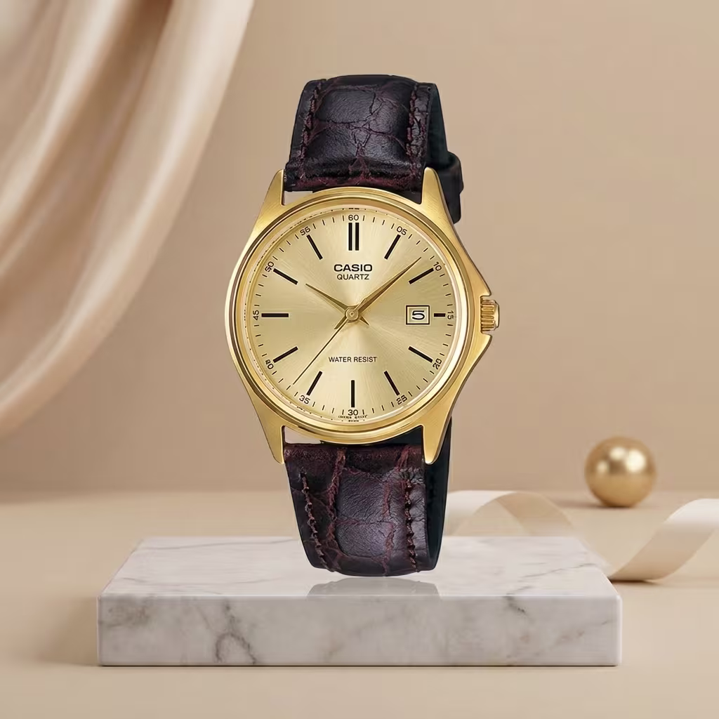Casio ladies gold dial watch with brown leather strap and date display