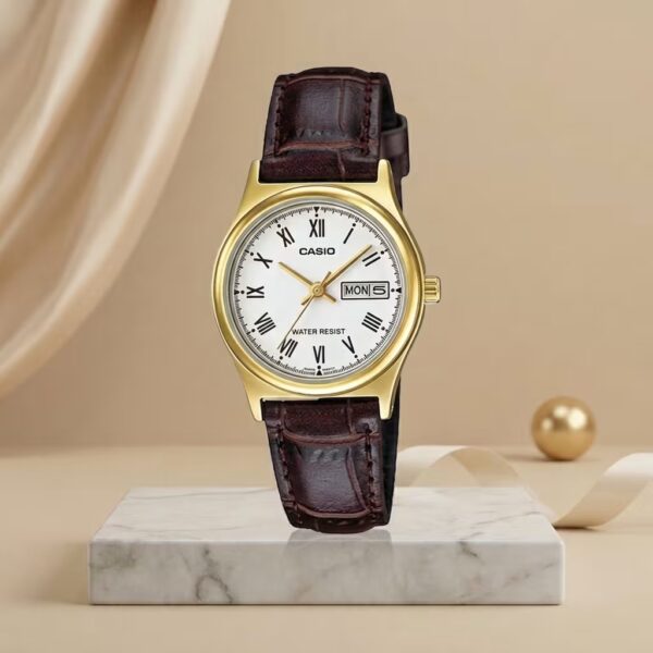 Casio ladies gold-tone watch with white Roman numeral dial, brown leather strap and day-date display