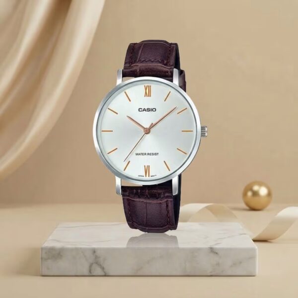 Casio ladies white dial watch with rose-gold markers, silver-tone case and brown leather strap