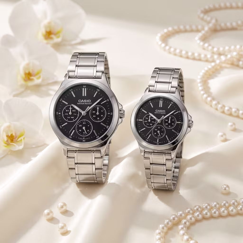 Casio couple watches with black multi-dial faces and silver stainless-steel bands