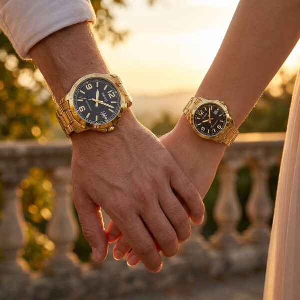 Couple wearing matching Casio black dial watches with golden stainless-steel bracelets