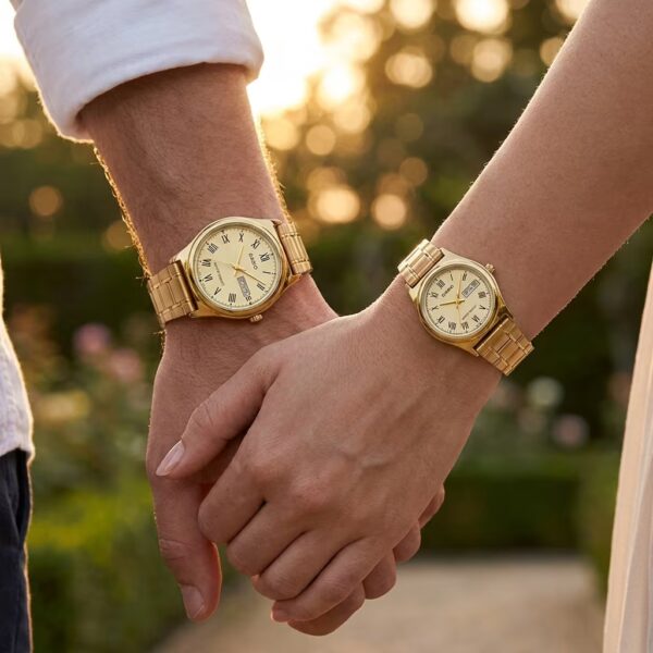 Couple wearing matching Casio golden watches with classic Roman numeral dials