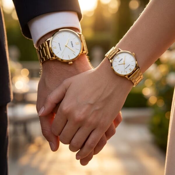 Couple wearing matching Casio white dial watches with golden stainless-steel bracelets