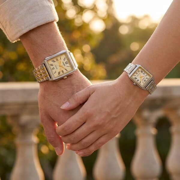 Couple wearing matching Casio rectangular gold and silver stainless-steel watches
