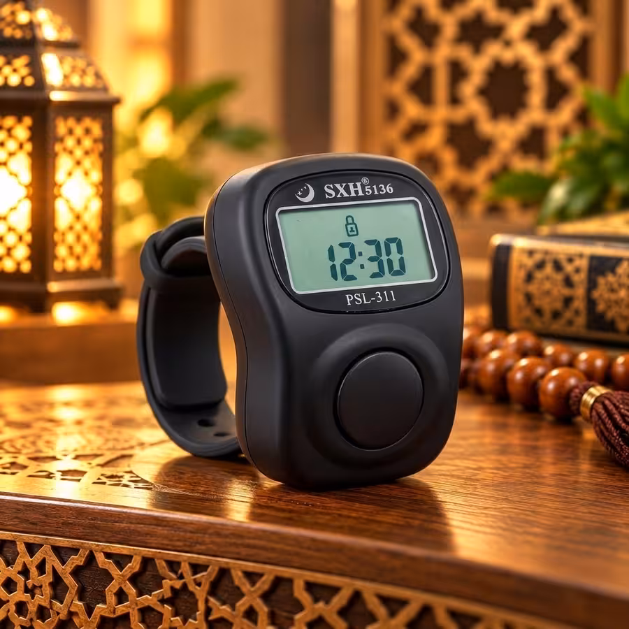 Matte black 8-channel digital Tasbeeh counter with LCD clock, large counting button and finger strap.
